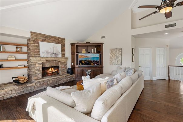 Fireplace, Interior, Living room, Recessed Lighting, Stone Walls, Wood Texture Flooring