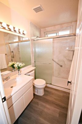Bathroom, Glass Shower, Interior, Marble Walls, Wood Texture Flooring