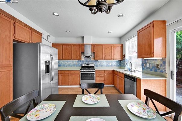 Dining room, Interior, Kitchen, Recessed Lighting, Stainless Steel Appliances, Wood Texture Flooring