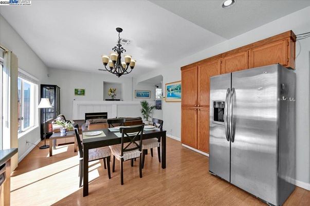 Chandelier, Dining room, Fireplace, Interior, Kitchen, Recessed Lighting, Stainless Steel Appliances, Wood Texture Flooring