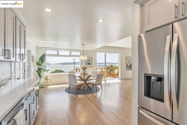 Dining room, Interior, Kitchen, Pendant Lights, Recessed Lighting, Stainless Steel Appliances, Water, Wood Texture Flooring