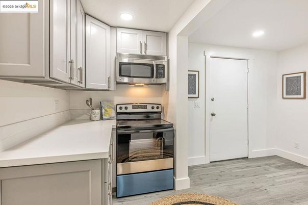 Interior, Kitchen, Recessed Lighting, Stainless Steel Appliances, Wood Texture Flooring