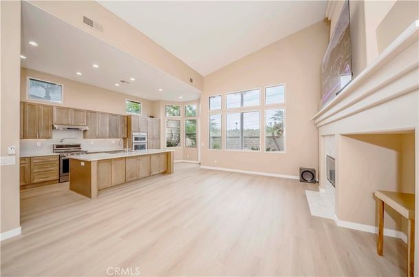 Fireplace, Interior, Kitchen, Recessed Lighting, Stainless Steel Appliances, Wood Texture Flooring