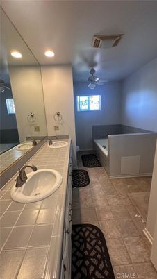 Bathroom, Dual Sink Vanities, Interior, Recessed Lighting, Tile Countertops