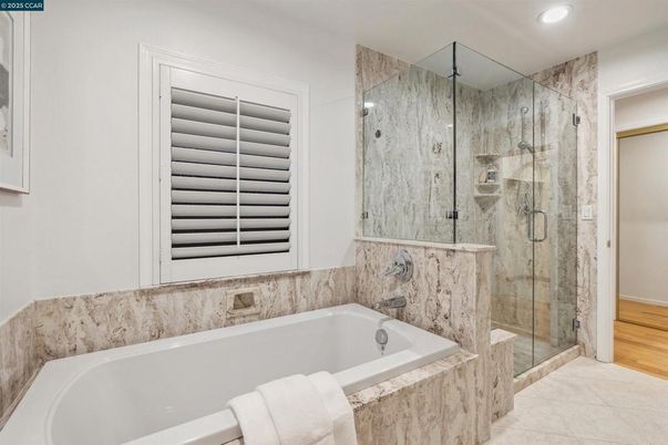 Bathroom, Glass Shower, Interior, Marble Walls, Recessed Lighting, Wood Texture Flooring