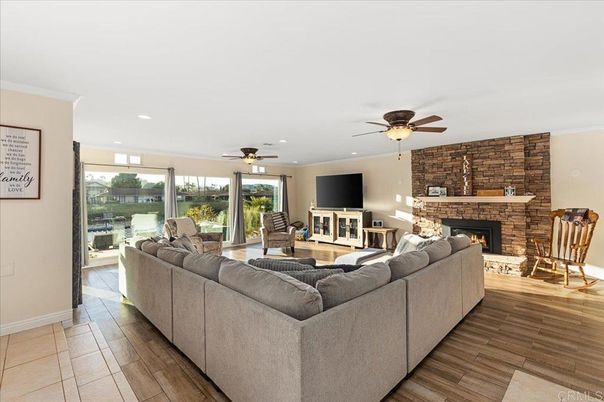Fireplace, Interior, Living room, Recessed Lighting, Stone Walls, Wood Texture Flooring