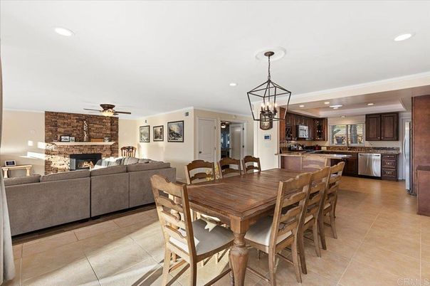 Chandelier, Dining room, Fireplace, Interior, Kitchen, Living room, Pendant Lights, Recessed Lighting, Stainless Steel Appliances, Stone Walls