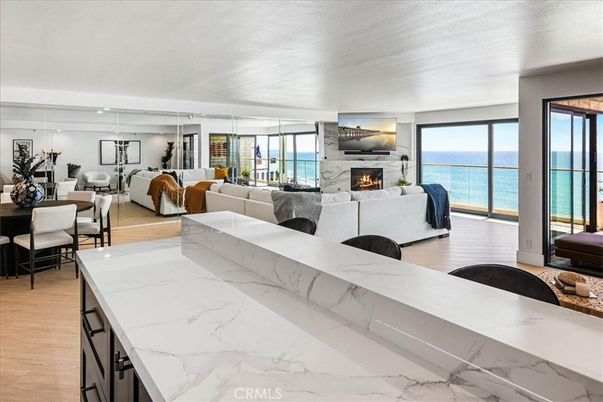 Dining room, Fireplace, Interior, Living room, Pendant Lights, Water, Wood Texture Flooring