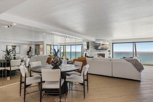 Dining room, Fireplace, Interior, Living room, Recessed Lighting, Water, Wood Texture Flooring