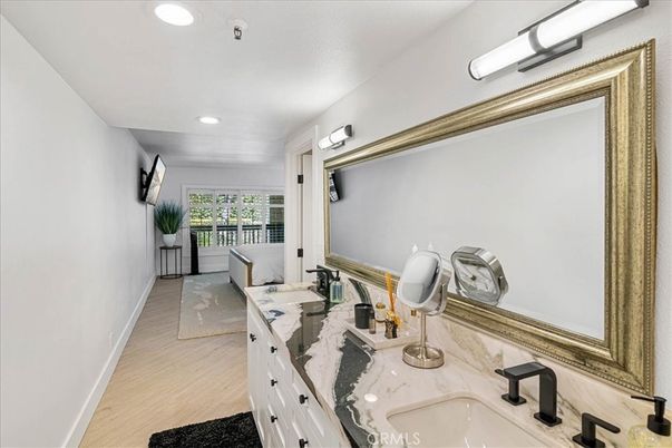 Bathroom, Dual Sink Vanities, Interior, Recessed Lighting, Wood Texture Flooring