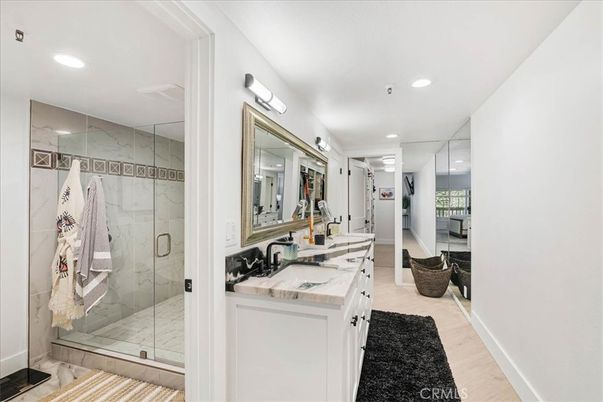 Bathroom, Dual Sink Vanities, Glass Shower, Interior, Marble, Marble Walls, Recessed Lighting