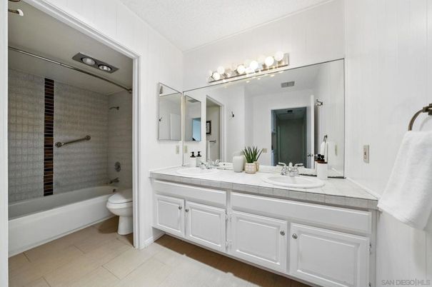 Bathroom, Dual Sink Vanities, Glass Shower, Interior, Tile Countertops, Wood Texture Flooring