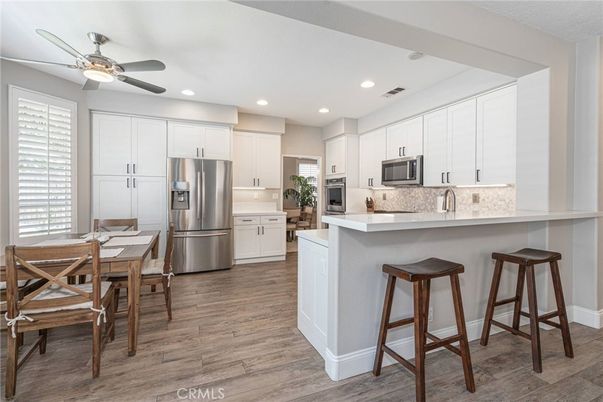 Dining room, Interior, Kitchen, Recessed Lighting, Stainless Steel Appliances, Wood Texture Flooring