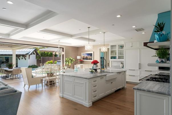 Chandelier, Dining room, Interior, Kitchen, Living room, Pendant Lights, Recessed Lighting, Stainless Steel Appliances, Wood Texture Flooring