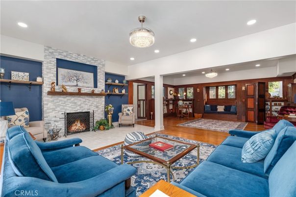 Chandelier, Dining room, Fireplace, Interior, Living room, Recessed Lighting, Stone Walls, Wood Texture Flooring