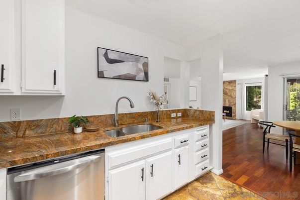 Fireplace, Interior, Kitchen, Stainless Steel Appliances, Wood Texture Flooring