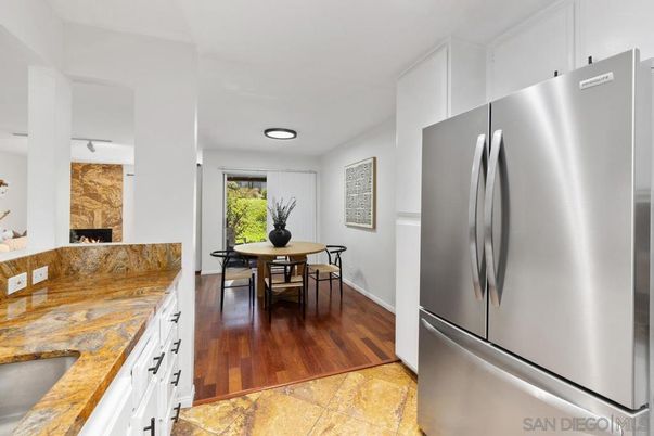 Dining room, Fireplace, Interior, Kitchen, Recessed Lighting, Wood Texture Flooring