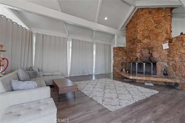 Fireplace, Interior, Living room, Recessed Lighting, Stone Walls, Wood Texture Flooring