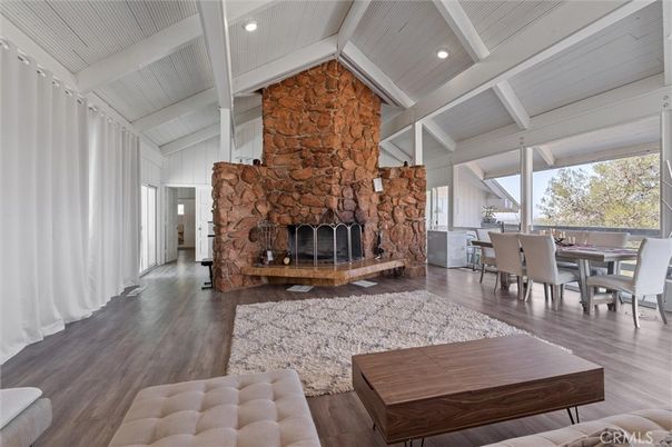 Dining room, Fireplace, Interior, Recessed Lighting, Stone Walls, Wood Texture Flooring