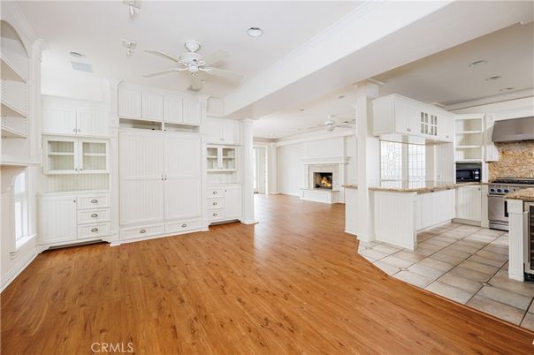 Empty room, Fireplace, Interior, Kitchen, Recessed Lighting, Wood Texture Flooring