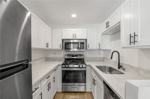 Interior, Kitchen, Recessed Lighting, Stainless Steel Appliances, Wood Texture Flooring