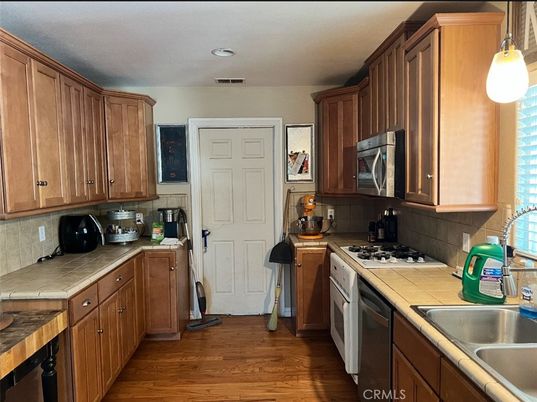 Interior, Kitchen, Recessed Lighting, Tile Countertops, Wood Texture Flooring