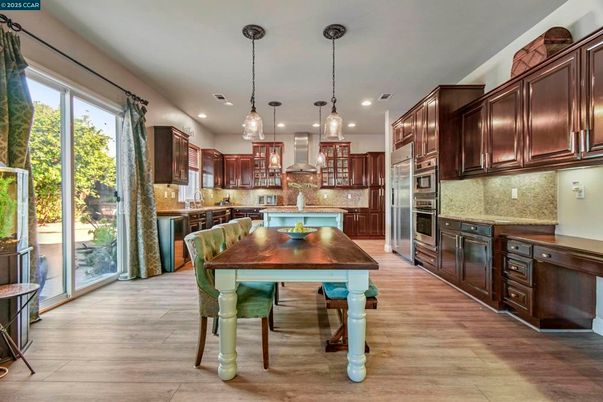 Dining room, Interior, Kitchen, Pendant Lights, Recessed Lighting, Stainless Steel Appliances, Wood Texture Flooring