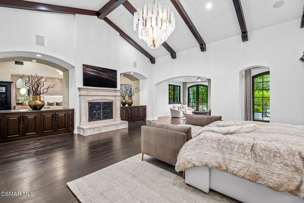 Bedroom, Chandelier, Fireplace, Interior, Recessed Lighting, Wooden Beams, Wood Texture Flooring