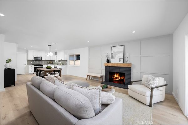 Dining room, Fireplace, Interior, Kitchen, Living room, Pendant Lights, Recessed Lighting, Stainless Steel Appliances, Wood Texture Flooring