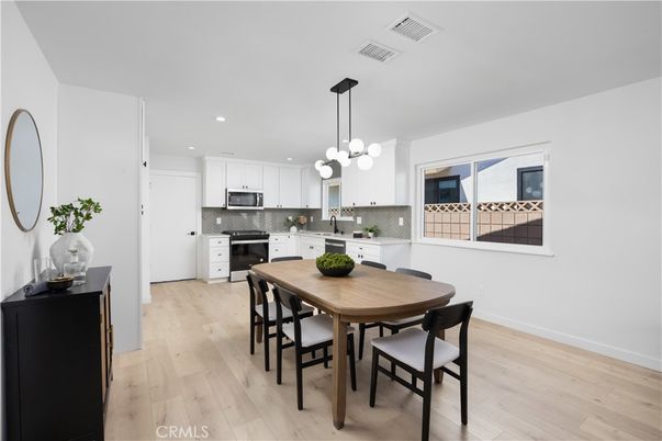 Dining room, Interior, Kitchen, Pendant Lights, Recessed Lighting, Stainless Steel Appliances, Wood Texture Flooring