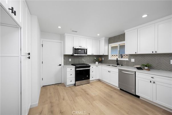 Interior, Kitchen, Recessed Lighting, Stainless Steel Appliances, Wood Texture Flooring
