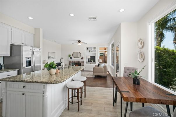 Fireplace, Interior, Kitchen, Living room, Recessed Lighting, Stainless Steel Appliances, Wood Texture Flooring