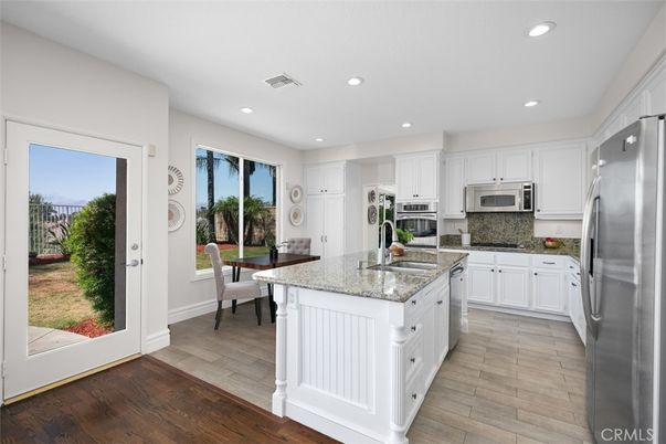 Dining room, Interior, Kitchen, Recessed Lighting, Stainless Steel Appliances, Wood Texture Flooring