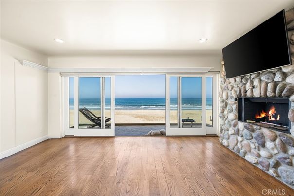 Empty room, Fireplace, Interior, Recessed Lighting, Stone Walls, Water, Wood Texture Flooring