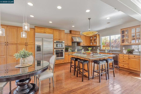 Dining room, Interior, Kitchen, Pendant Lights, Recessed Lighting, Stainless Steel Appliances, Wood Texture Flooring