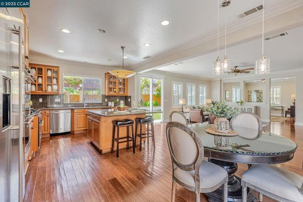 Dining room, Fireplace, Interior, Living room, Pendant Lights, Recessed Lighting, Wood Texture Flooring