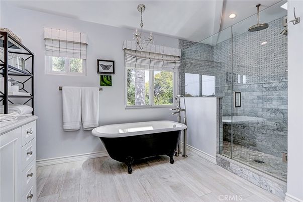 Bathroom, Chandelier, Free Standing Baths, Glass Shower, Interior, Marble Walls, Recessed Lighting, Wood Texture Flooring