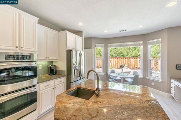 Dining room, Interior, Kitchen, Recessed Lighting, Stainless Steel Appliances, Wood Texture Flooring