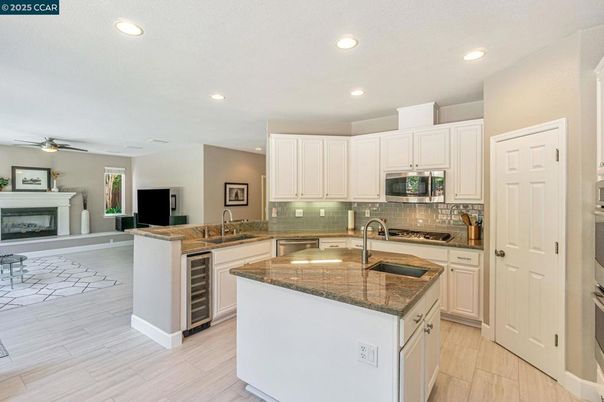 Fireplace, Interior, Kitchen, Recessed Lighting, Wood Texture Flooring