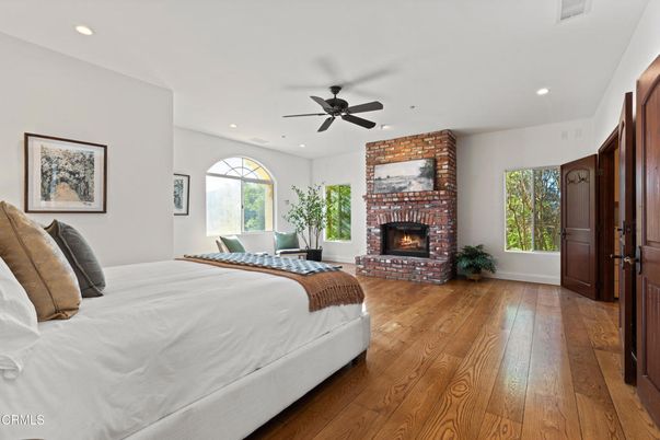 Bedroom, Fireplace, Interior, Recessed Lighting, Stone Walls, Wood Texture Flooring
