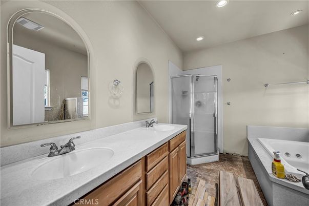Bathroom, Dual Sink Vanities, Glass Shower, Interior, Recessed Lighting, Wood Texture Flooring