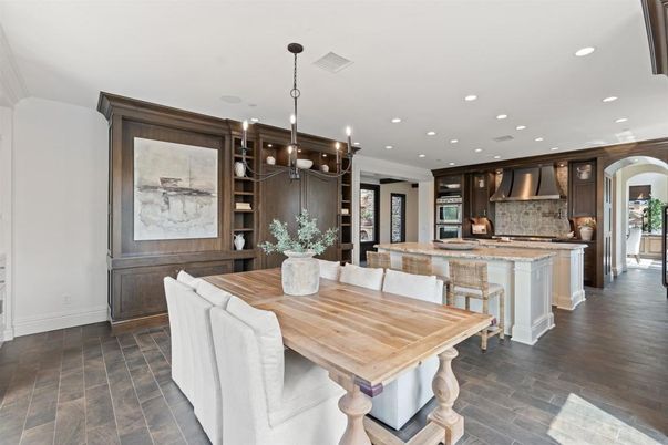 Chandelier, Dining room, Interior, Kitchen, Pendant Lights, Recessed Lighting, Stainless Steel Appliances, Wood Texture Flooring