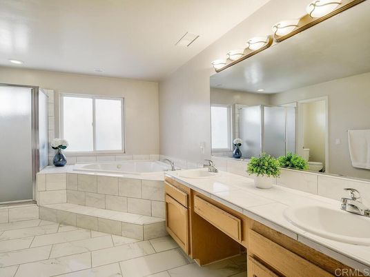 Bathroom, Dual Sink Vanities, Glass Shower, Interior, Marble, Recessed Lighting, Tile Countertops