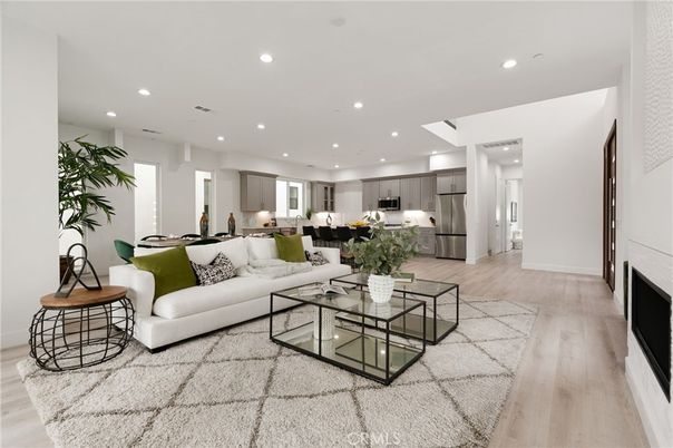 Dining room, Fireplace, Interior, Kitchen, Living room, Recessed Lighting, Stainless Steel Appliances, Wood Texture Flooring