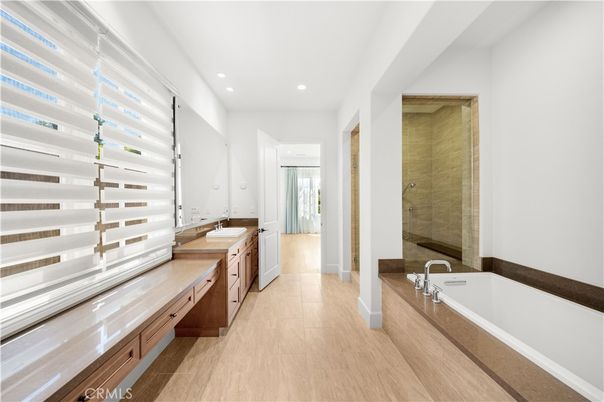 Bathroom, Dual Sink Vanities, Glass Shower, Interior, Recessed Lighting, Wood Texture Flooring