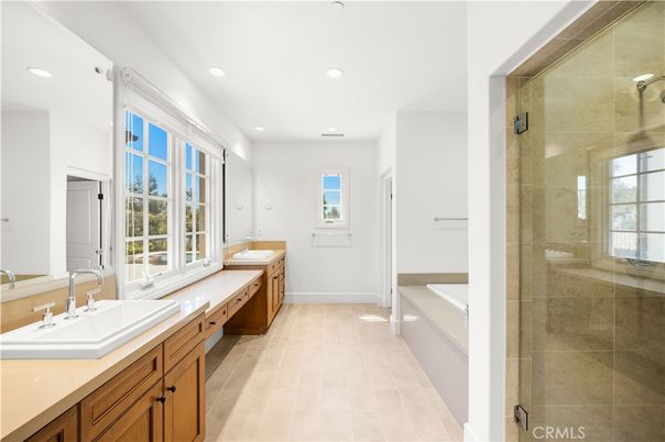 Bathroom, Dual Sink Vanities, Glass Shower, Interior, Recessed Lighting, Wood Texture Flooring