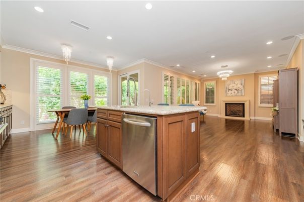 Chandelier, Dining room, Fireplace, Interior, Kitchen, Recessed Lighting, Stainless Steel Appliances, Wood Texture Flooring
