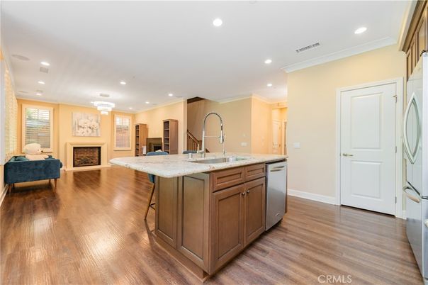 Chandelier, Fireplace, Interior, Kitchen, Living room, Recessed Lighting, Wood Texture Flooring
