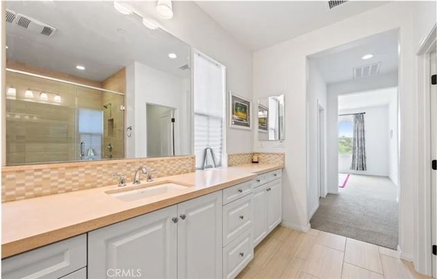 Bathroom, Dual Sink Vanities, Glass Shower, Interior, Recessed Lighting, Wood Texture Flooring