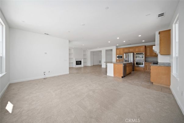 Empty room, Fireplace, Interior, Kitchen, Recessed Lighting, Stainless Steel Appliances